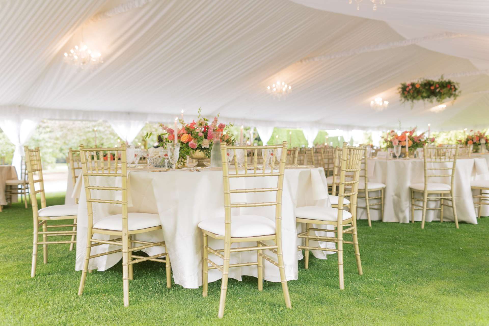Wedding reception in White Tent with Gold Chiavari Chairs