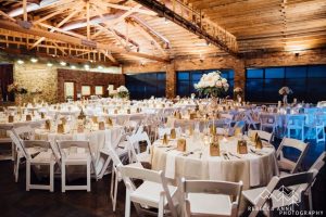 Tacoma wedding indoor venue with white tables and chairs for wedding reception