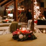 Vintage Christmas party d&eacute;cor at The Kelley Farm, featuring velvet green linens, candles, and festive holiday accents.